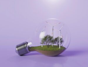Il futuro delle energie rinnovabili è legato soprattutto al potenziamento di tecnologie come fotovoltaico e pale eoliche. Nella foto, una lampadina con all'interno delle pale eoliche. Raffigurazione simbolica di una società sostenibile.